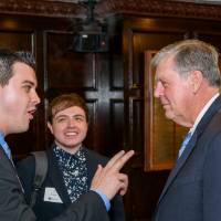guests talking with President Haas